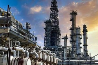 Phillips 66 Co. has entered into a definitive agreement to acquire the remaining 50% interest in WRB Refining LP from partner Cenovus Energy Inc. for $1.4 billion in cash, ending a nearly 20-year joint venture between the companies. Upon scheduled close of the transaction later this year, Phillips 66 will take full ownership of the 345,000-b/d Wood River refinery in Roxana, Ill., and the 149,000-b/d Borger refinery in Borger, Tex., both of which Phillips 66 has operated since the WRB Refining JV’s formation in 2007. Mark Lashier, Phillips 66’s chairman and chief executive officer, said full ownership will improve integration with the company’s broader value chain and generate about $50 million in annual synergies. He also noted the potential for future low-cost, high-return projects tied to the assets. Cenovus’s divestment of interest in the refineries comes as part of the company’s strategy of owning and operating the assets that are core to its business, according to Jon McKenzie, Cenovus’s president and chief executive officer. “After the sale of WRB, our downstream business will be more focused, comprised of assets we control, which provide physical integration and egress for our leading upstream heavy oil business,” McKenzie said. Located in the US Midwest refining hub near St. Louis, Wood River is one of the largest refineries in the region. Equipped with units for coking, hydrocracking, and hydrotreating, the refinery can run a high percentage of heavy Canadian crude. A more complex inland refinery that processes a range of crudes—including domestic light sweet and Western Canadian blends—Borger serves markets across West Texas, New Mexico, and the US Southwest. The site features key units for fluid catalytic cracking, delayed coking, and alkylation. Together, the two refineries will increase Phillips 66’s overall nameplate refining capacity by about 250,000 b/d and deepen its presence in inland US markets. Already operated by Phillips 66, both plants are also integrated with the company’s midstream and marketing assets. Strategic implications The proposed transaction comes at a time when many US refiners are reassessing long-term capital allocation, portfolio optimization, and regional integration. Unlike peers that are shedding refining assets or reducing exposure, Phillips 66 has maintained a balanced position between refining, midstream, and chemicals. “This acquisition strengthens our integrated value chain and increases our flexibility in a key region where we have scale and market access,” said Lashier. “By taking full ownership, we expect to capture approximately $50 million/year in operational and commercial synergies.” As of mid-2025, Phillips 66 operates 12 refineries with a combined capacity of over 2.2 million b/d. The WRB acquisition will push total capacity close to 2.5 million b/d, solidifying its position as one of the largest US-based independent refiners. While Phillips 66 continues to invest in lower-carbon initiatives and renewable fuels, its core refining portfolio remains a key earnings contributor. The company has been focusing on optimizing existing assets rather than greenfield expansion, and recent capital has largely gone into yield improvements, reliability, and co-processing upgrades.